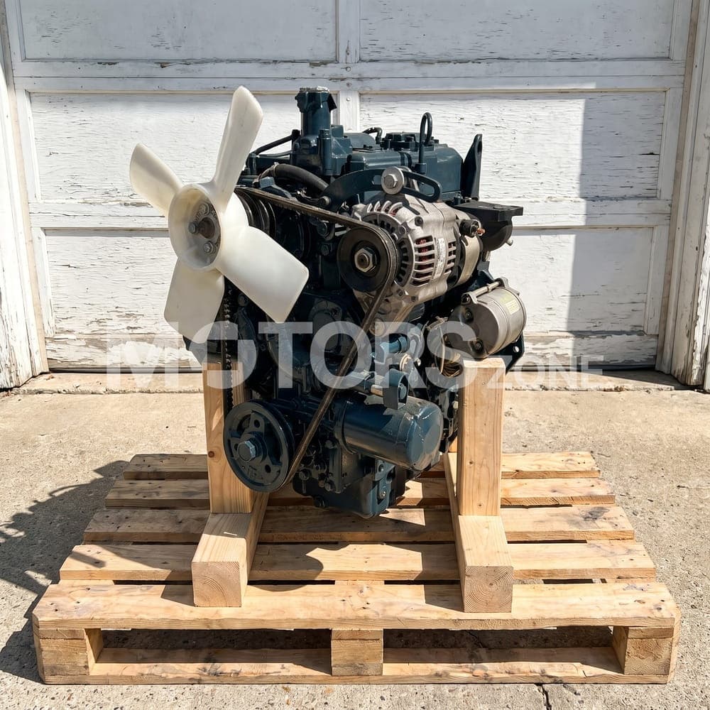 Moteur Kubota D1105 reçu par un client, devant une porte de garage
